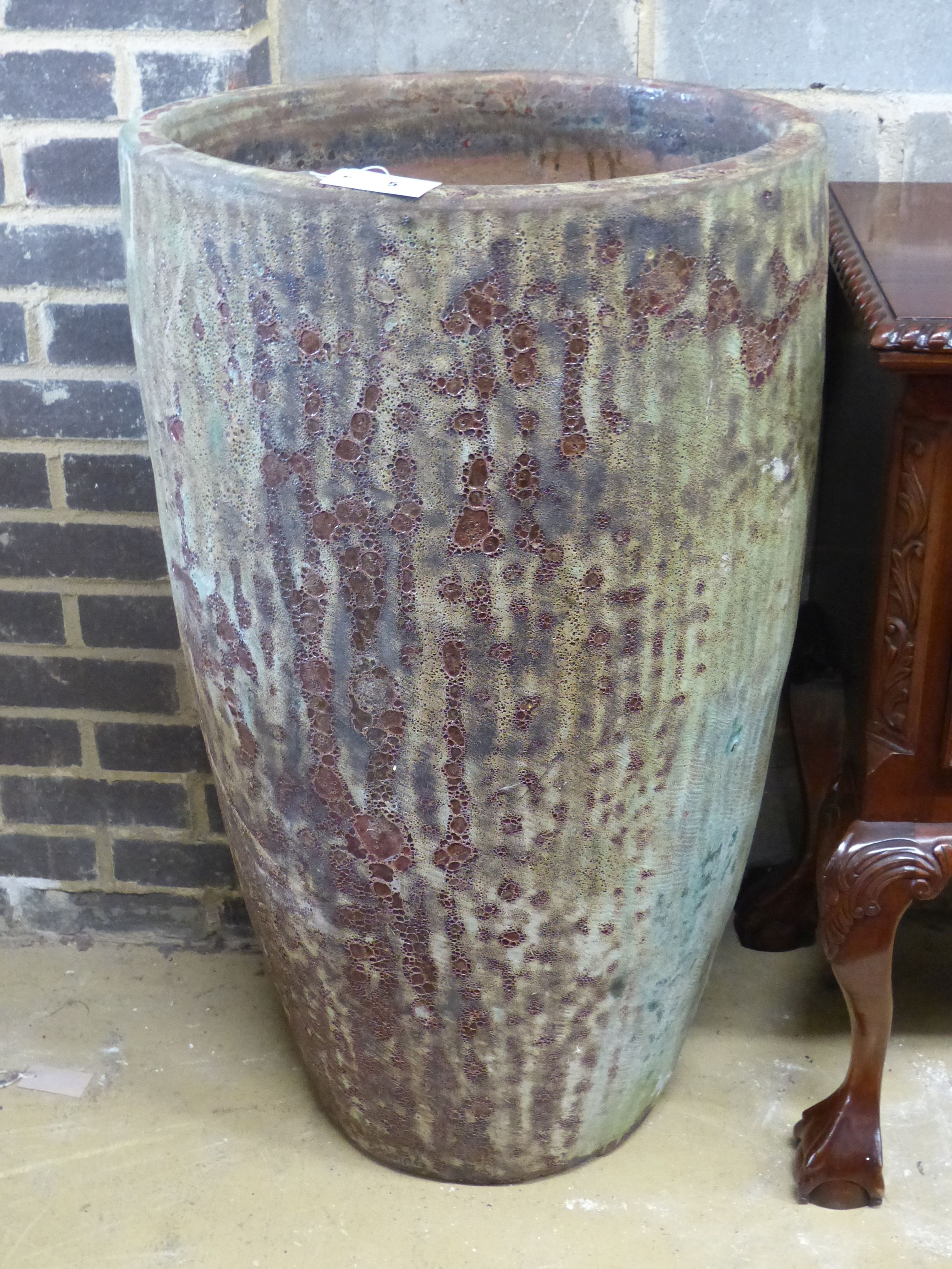 A tall glazed Earthenware garden planter, diameter 54cm height 94cm